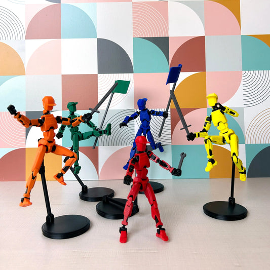 Orange, red, blue, green, and yellow Dummy 13's in different posed positions